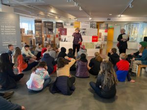 Two docents leading a school group tour in our Core Exhibitions.